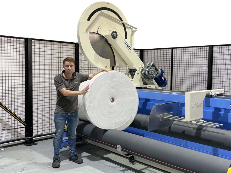 Roll cutter slitter into ribbons and blocks